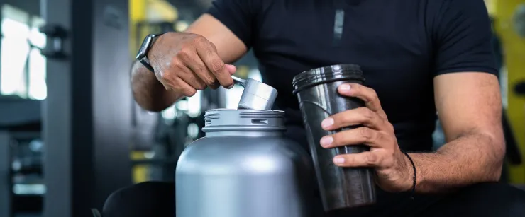 https://i0.wp.com/whatsgood.vitaminshoppe.com/wp-content/uploads/2022/10/man-scooping-protein.jpg?fit=740%2C307&ssl=1